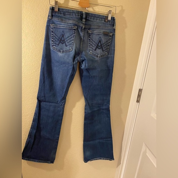 7 for all mankind boot cut flare jeans. Size 27. Medium wash. Faded front. - Picture 2 of 16
